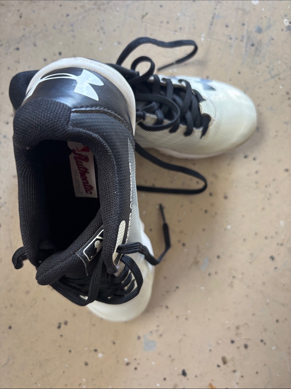 Under Armour Kids Black and White Cleats with Logo